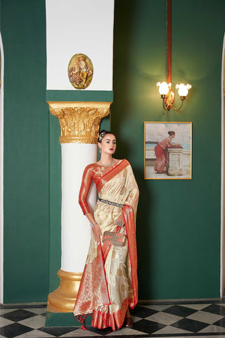 CREAM LINEN FLORAL AND BOTANICAL GOLDEN ZARI BUTTA WITH ETHNIC MOTIF PALLU AND TASSEL IN BORDER SAREE