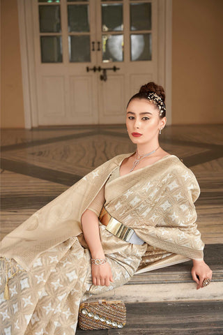 CREAM SILK LINEN CHECKERED IN BOTANICAL DESIGN BUTTA SAREE WITH ETHNIC MOTIF PALLU AND TASSEL IN BORDER