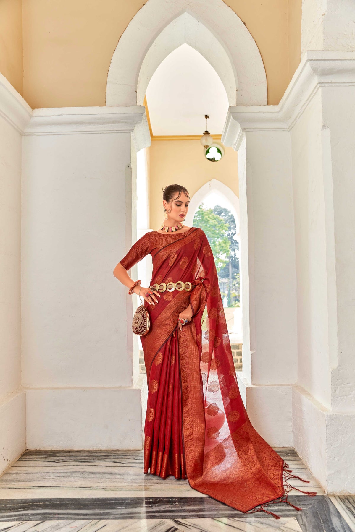 RED LINEN FLORAL COPPER ZARI BUTTA SAREE WITH BOTANICAL WOVEN BUTTA PALLU AND TASSEL IN BORDER