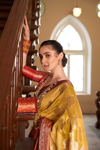 ORANGE LINEN BOTANICAL BUTTA SAREE WITH ETHNIC MOTIF GOLDEN ZARI RED PALLU AND TASSEL IN BORDER