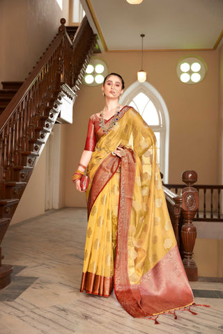 ORANGE LINEN BOTANICAL BUTTA SAREE WITH ETHNIC MOTIF GOLDEN ZARI RED PALLU AND TASSEL IN BORDER