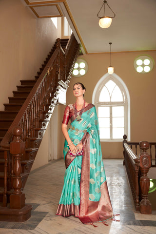 TURQUOISE LINEN BOTANICAL BUTTA SAREE WITH ETHNIC MOTIF GOLDEN ZARI RED PALLU AND TASSEL IN BORDER