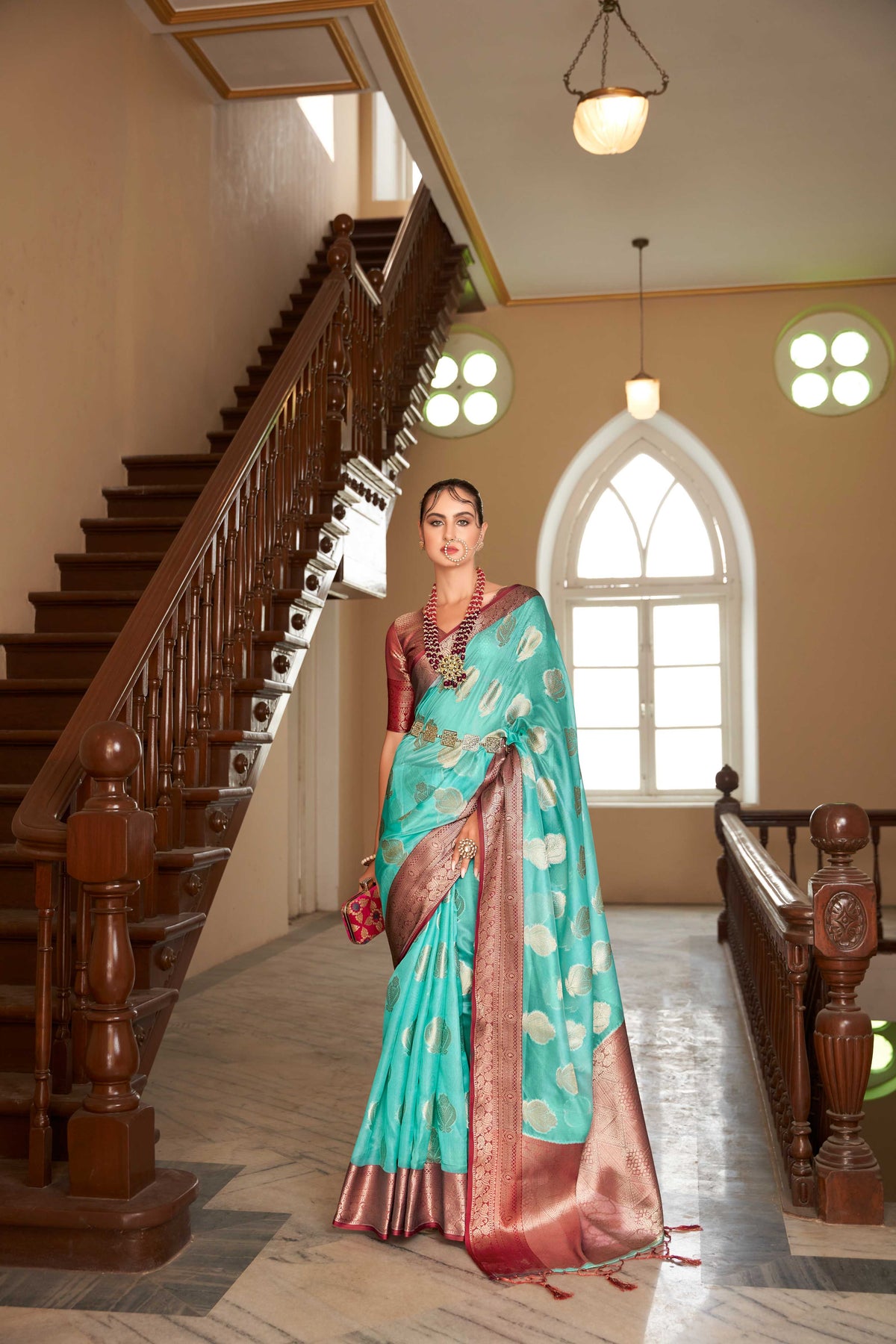 TURQUOISE LINEN BOTANICAL BUTTA SAREE WITH ETHNIC MOTIF GOLDEN ZARI RED PALLU AND TASSEL IN BORDER